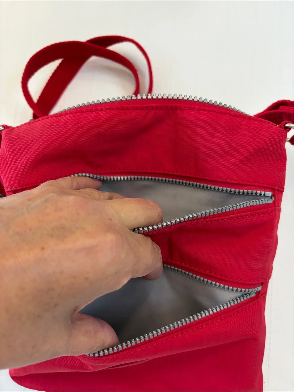 Kipling Red Crossbody with Playful Pom Charm
